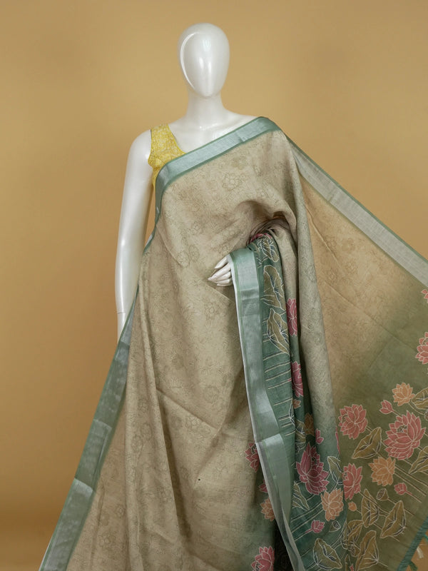 Beige and sage green linen cotton saree with silver zari border and pink lotus print pallu