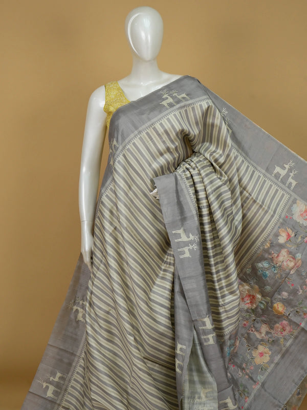 Grey and cream designer saree with embroidered deer motifs and floral pallu