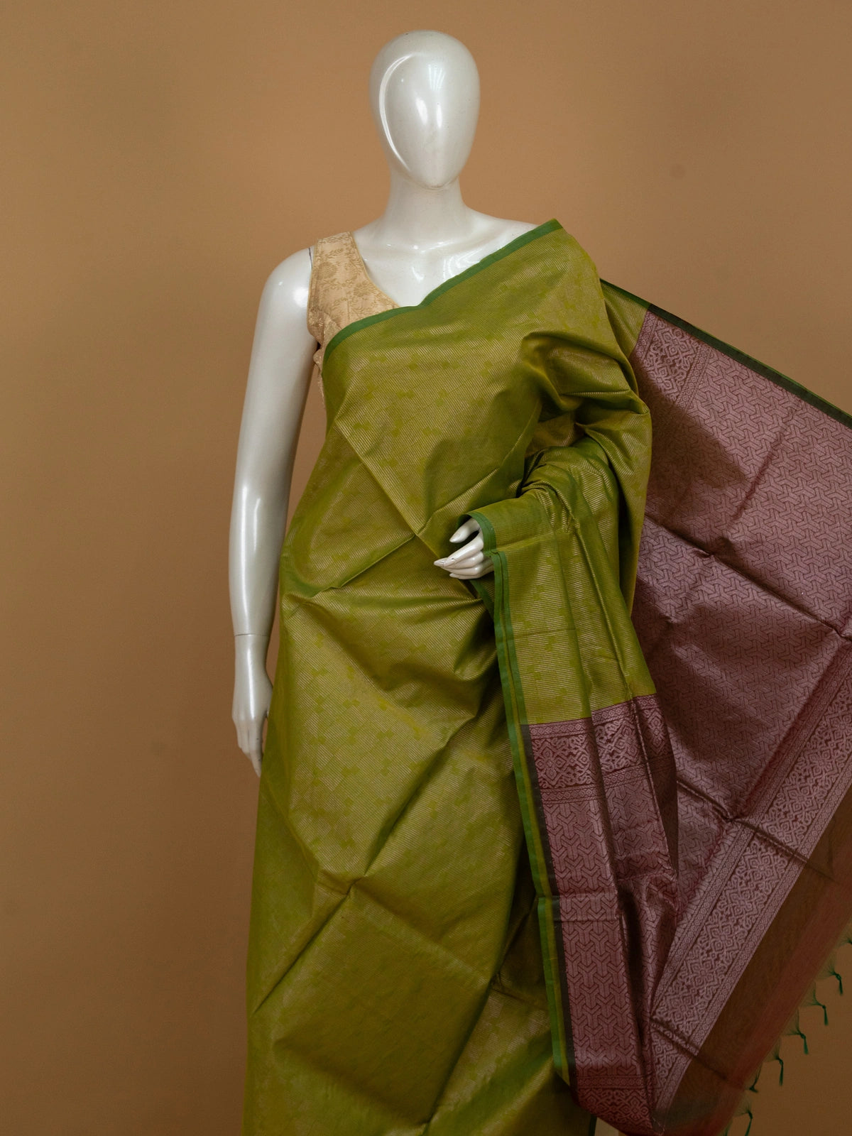 Mehendi green silk cotton saree with contrast maroon geometric zari pallu and green border