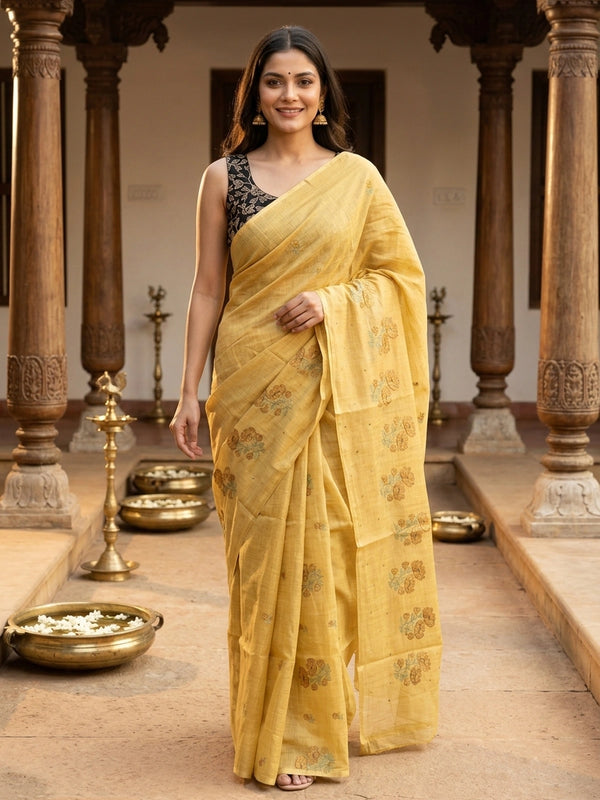Yellow linen cotton saree with floral embroidered buttas and contrast black blouse