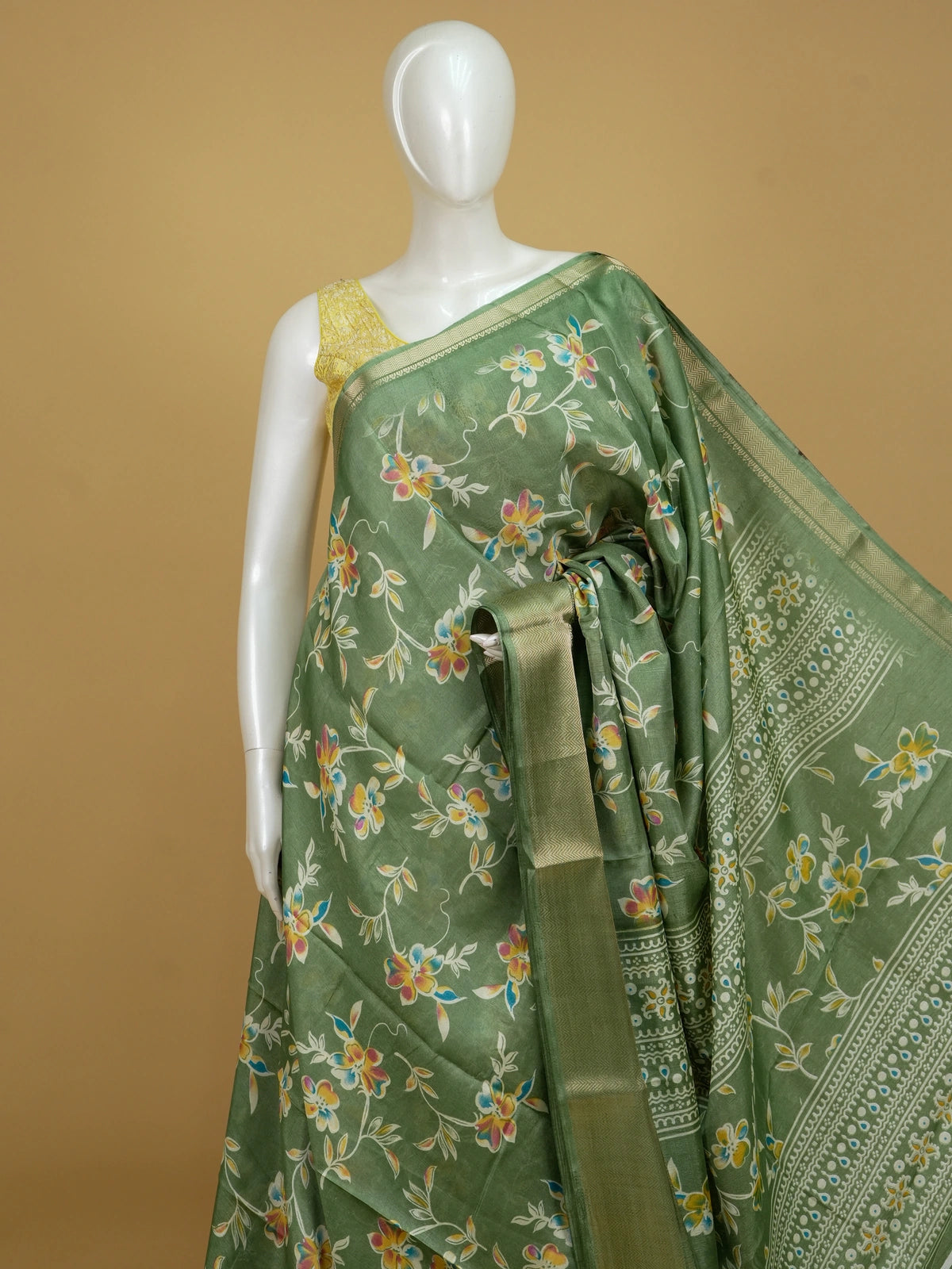 Green floral printed designer saree with gold zari border and decorative pallu
