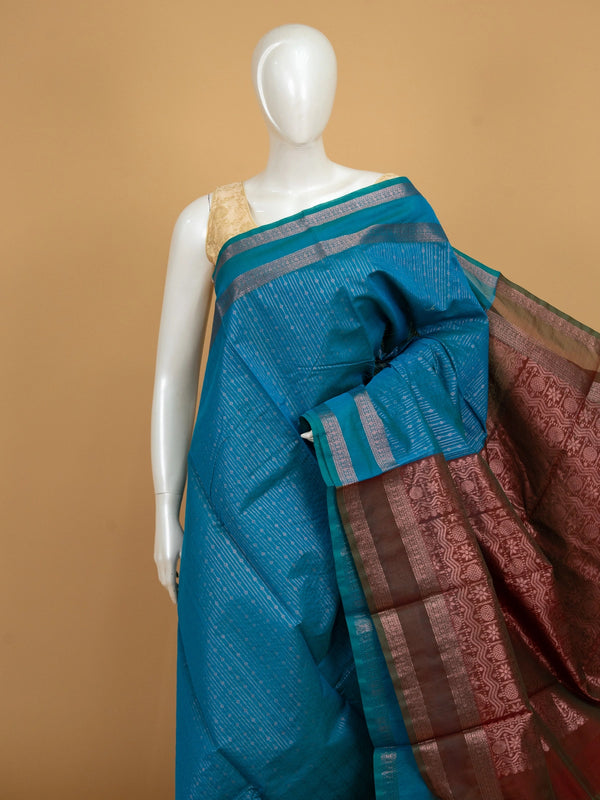 Peacock blue silk cotton saree with silver zari stripes and contrast maroon zari pallu