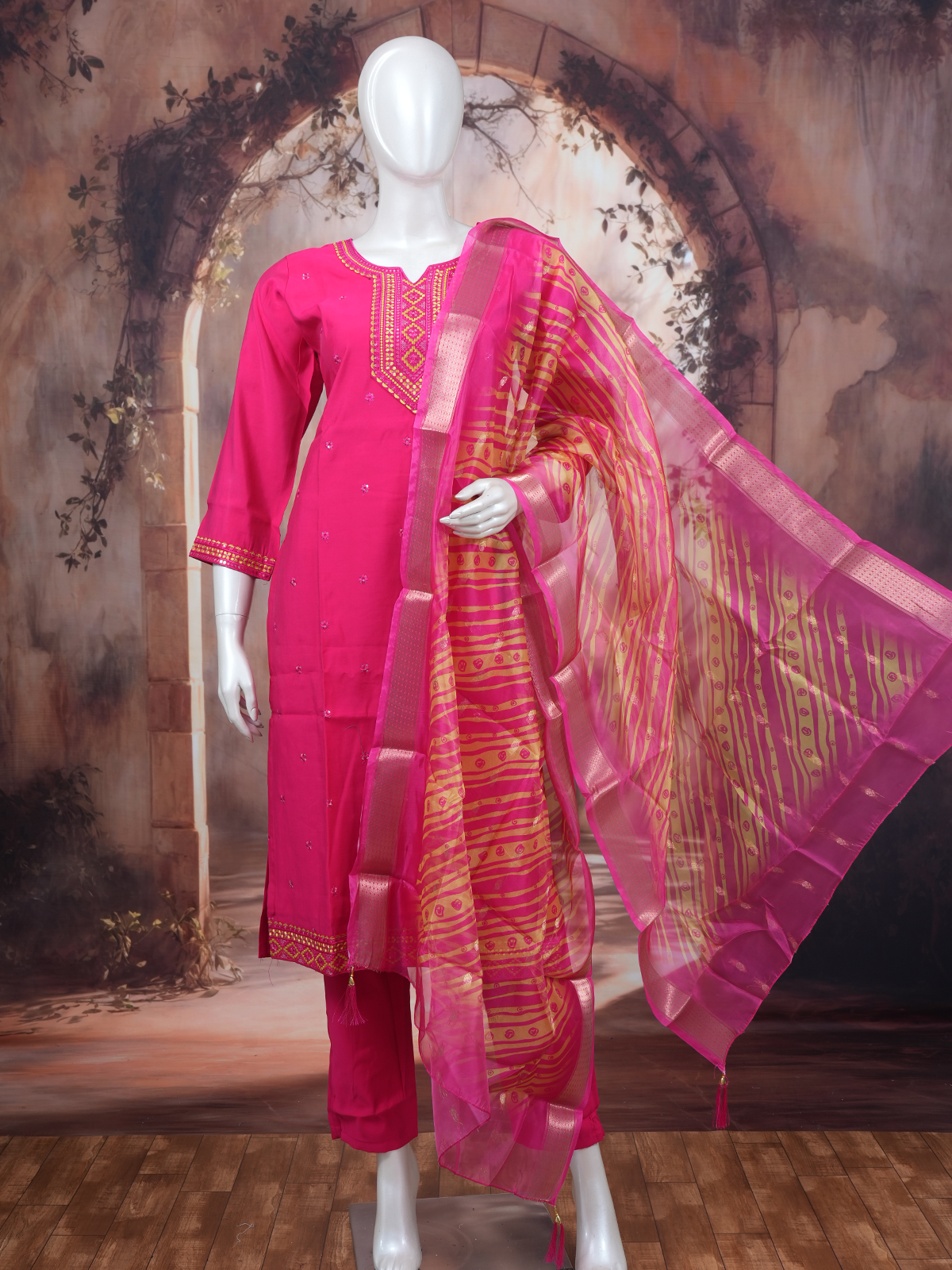 Rani pink embroidered kurti set with golden yoke and leheriya striped dupatta