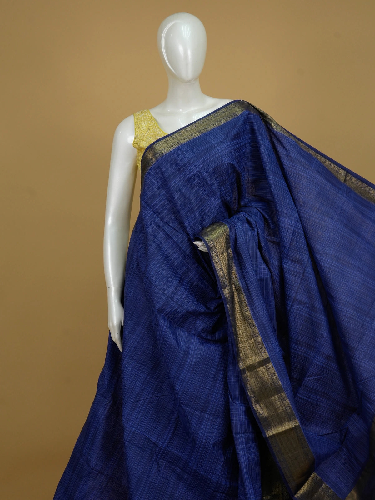 Royal blue designer saree with checked weave and broad gold zari border