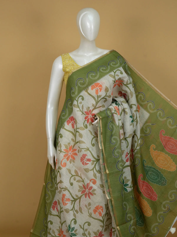 Cream linen cotton saree with floral print, green scrollwork border and paisley pallu