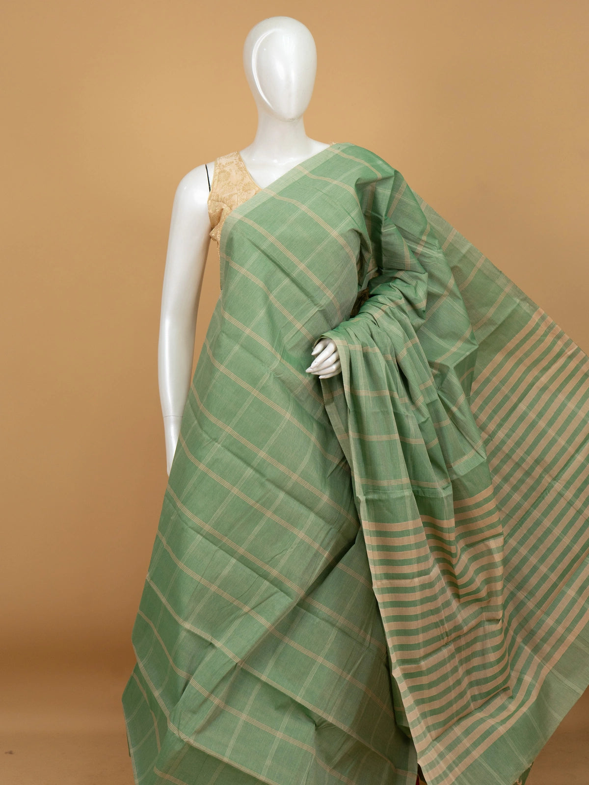 Sage green and beige checked silk cotton saree with striped pallu and contrast cream blouse