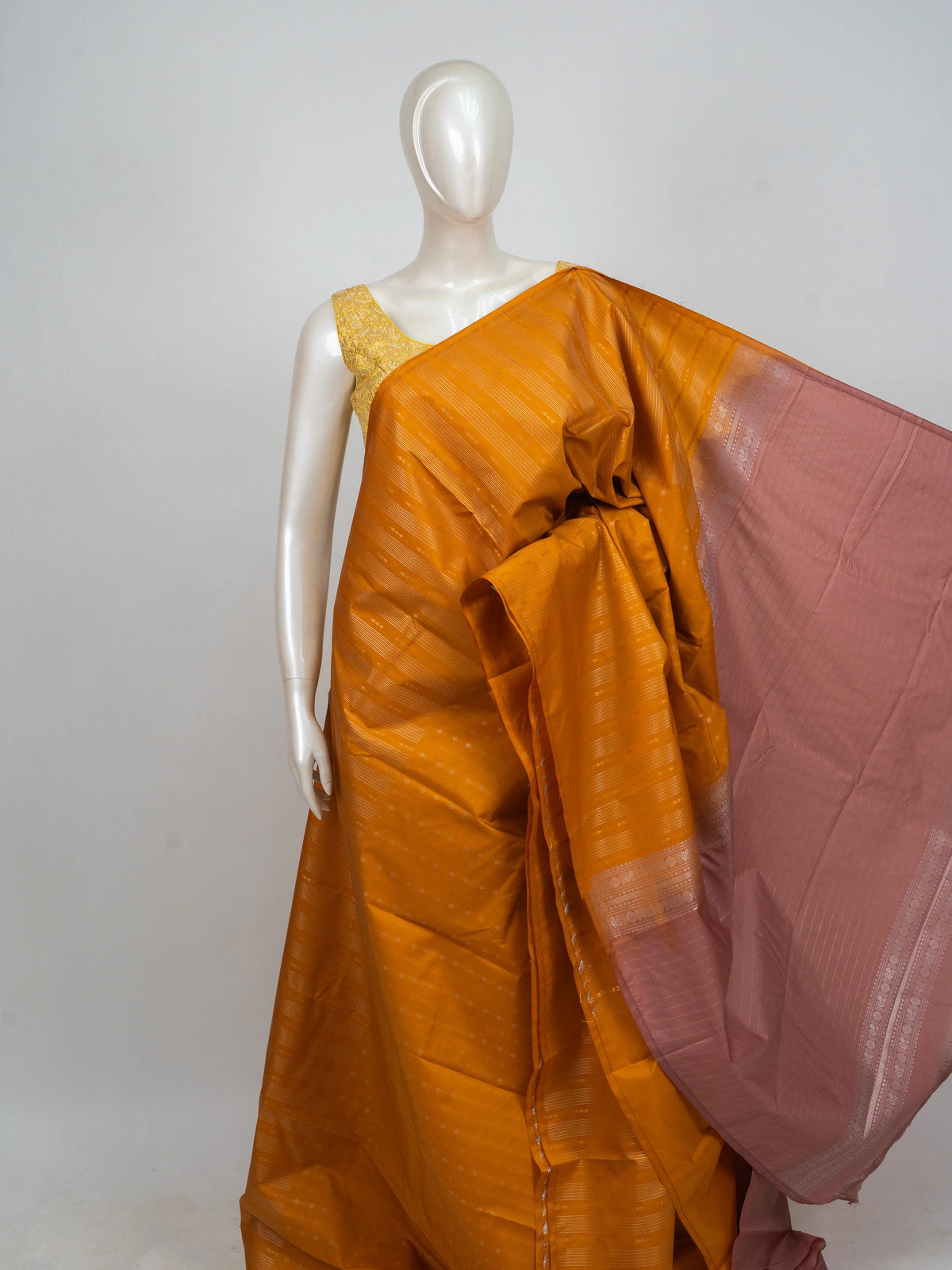 Mustard yellow semi silk saree with silver zari stripes and contrast dusty pink border and pallu
