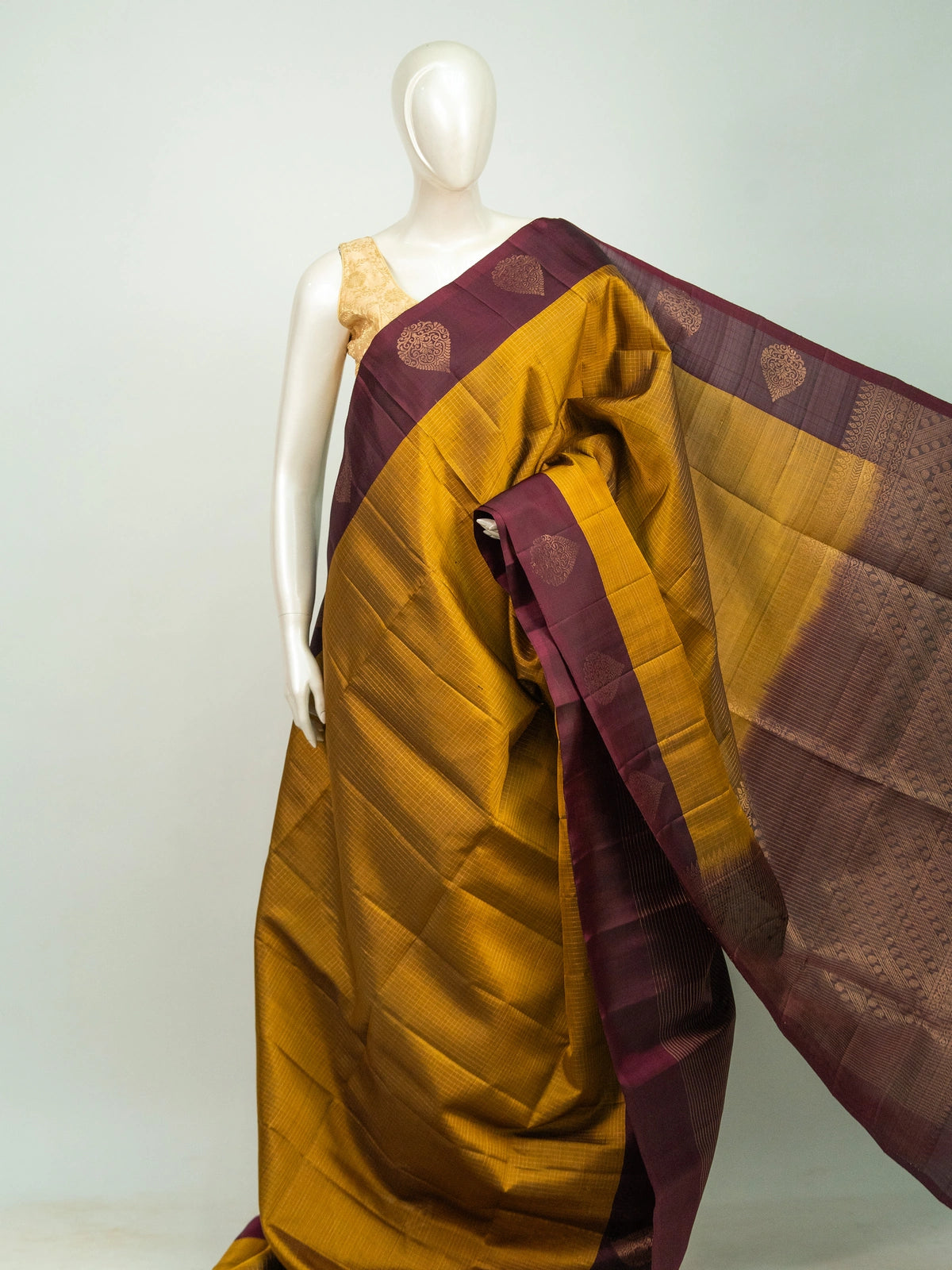 Mustard yellow pure soft silk saree with maroon contrast border and gold zari checks