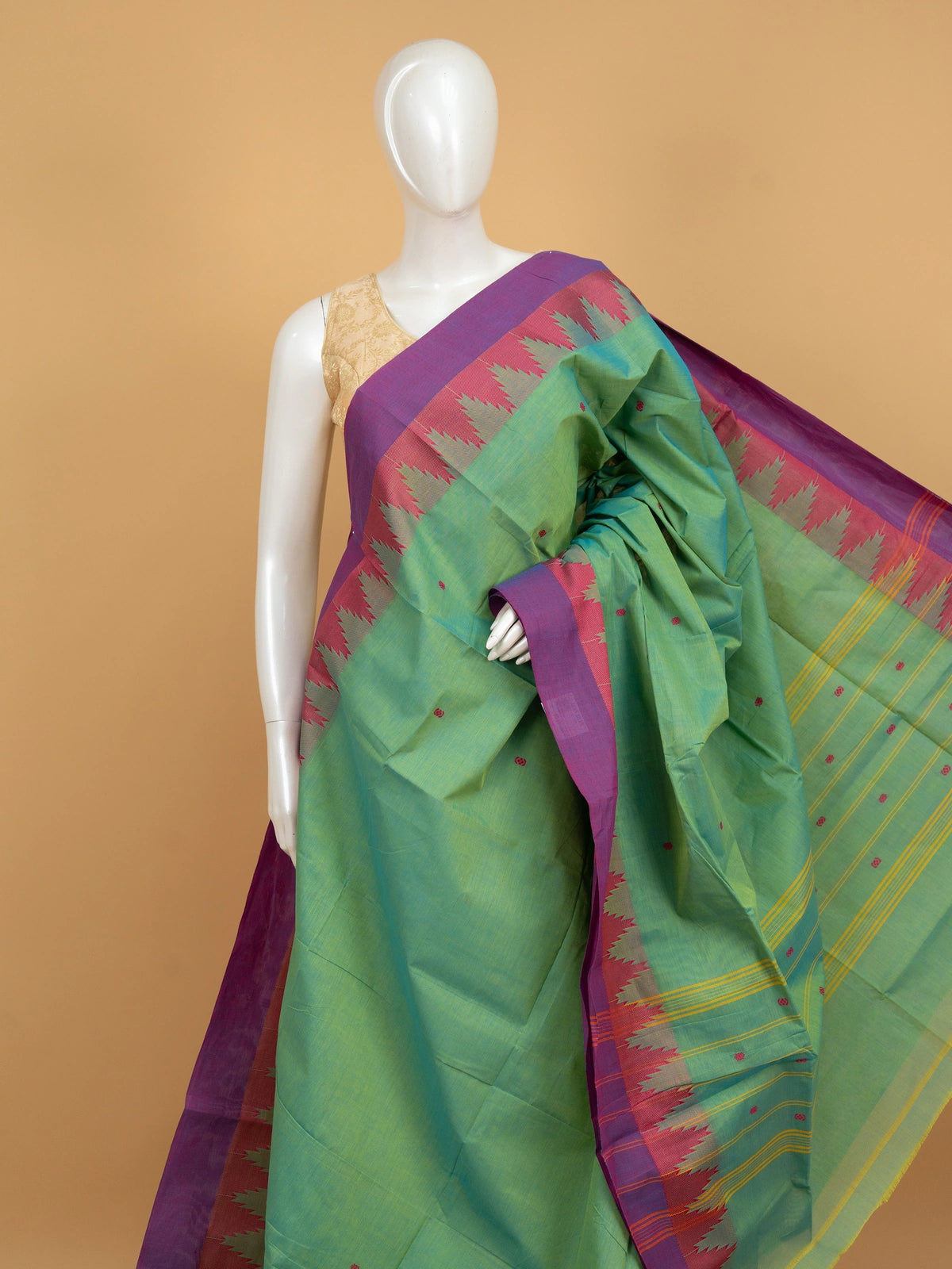 Green Chettinad cotton saree with pink and purple temple border and woven buttas