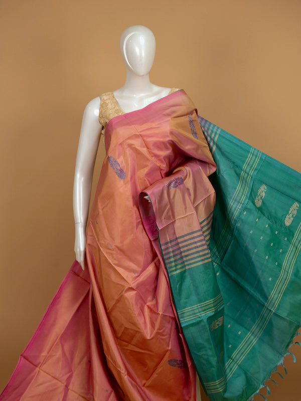 Peach pink and teal green banana silk saree with gold zari buttas and contrast striped pallu