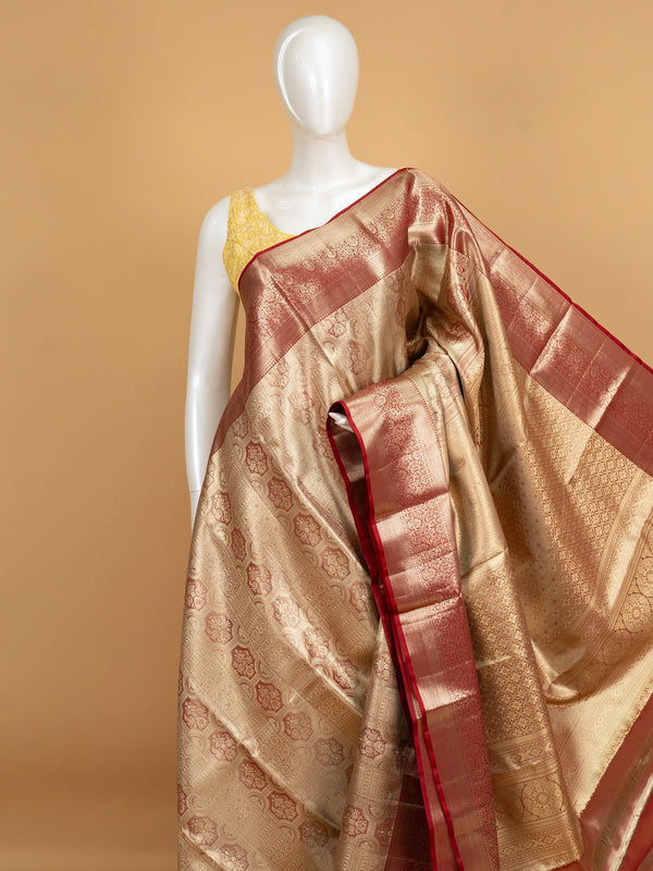 Golden beige pure Kanchipuram silk saree with gold zari motifs and contrast maroon border and pallu