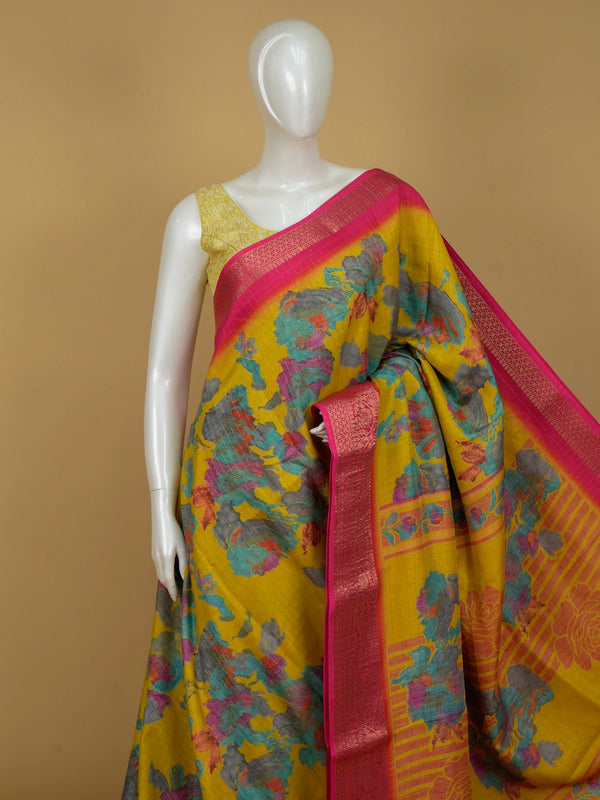 Yellow Dola silk saree with multicoloured floral print and contrast pink zari border
