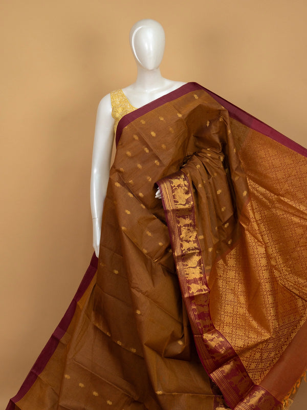 Mustard brown Chettinad cotton saree with maroon contrast border, gold zari buttas and woven pallu