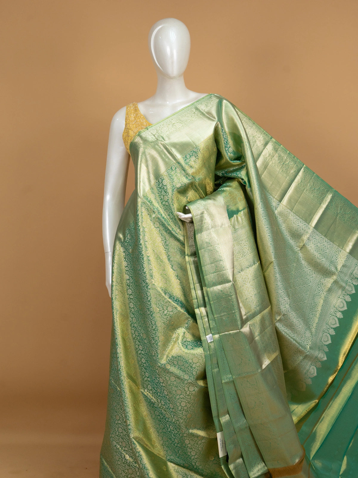 Green pure Kanchipuram silk saree with all-over gold zari floral jaal and broad zari border