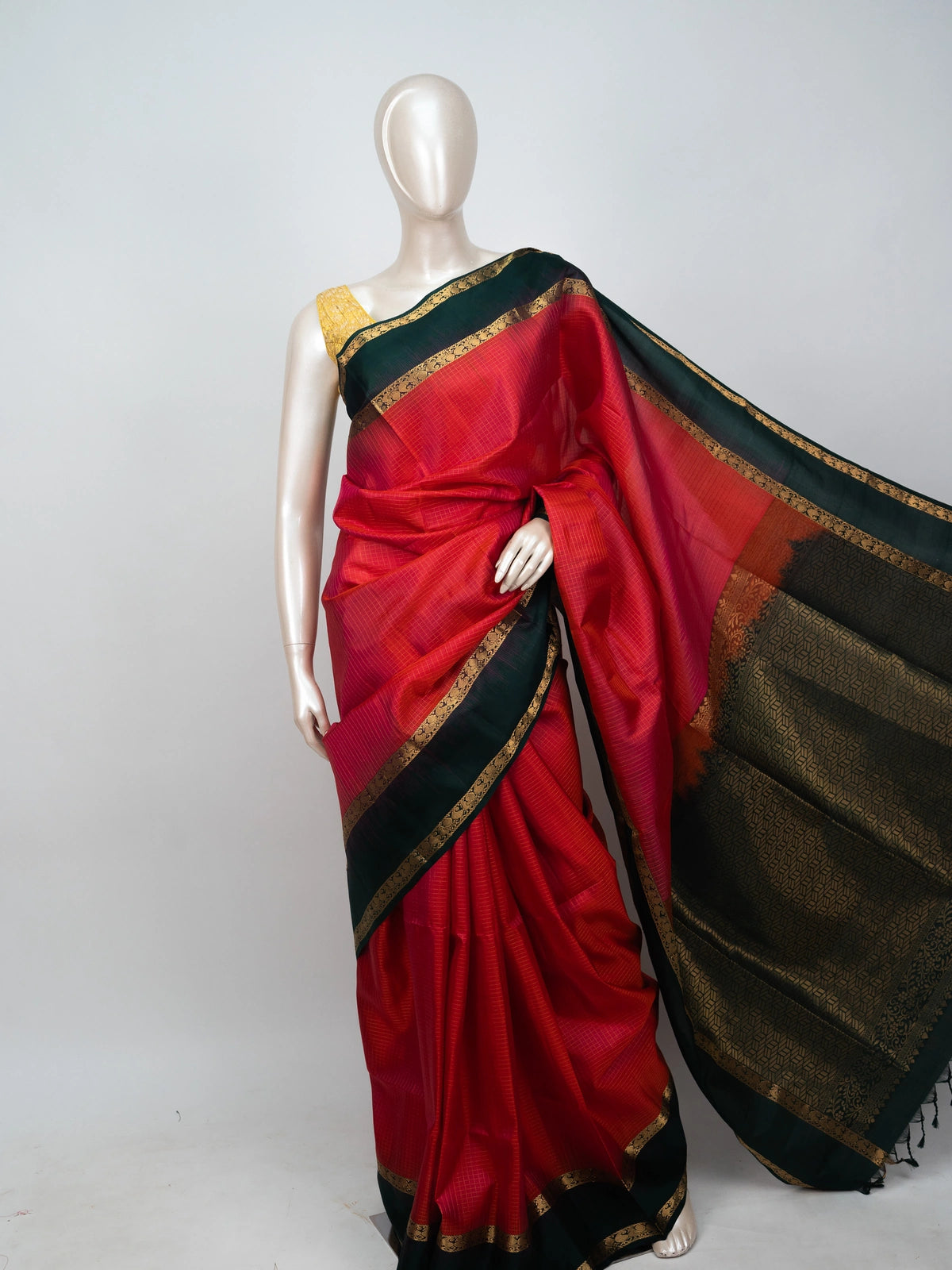 Red soft silk saree with contrast dark green gold zari border and woven zari pallu