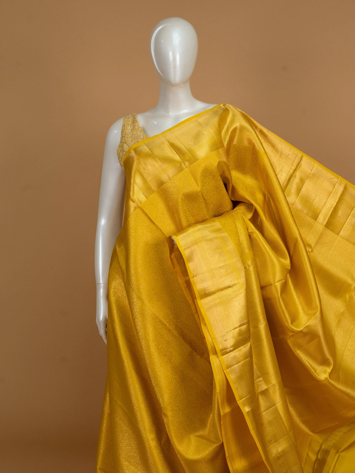 Yellow and gold pure Kanchipuram silk saree with all-over zari jaal and motif pallu