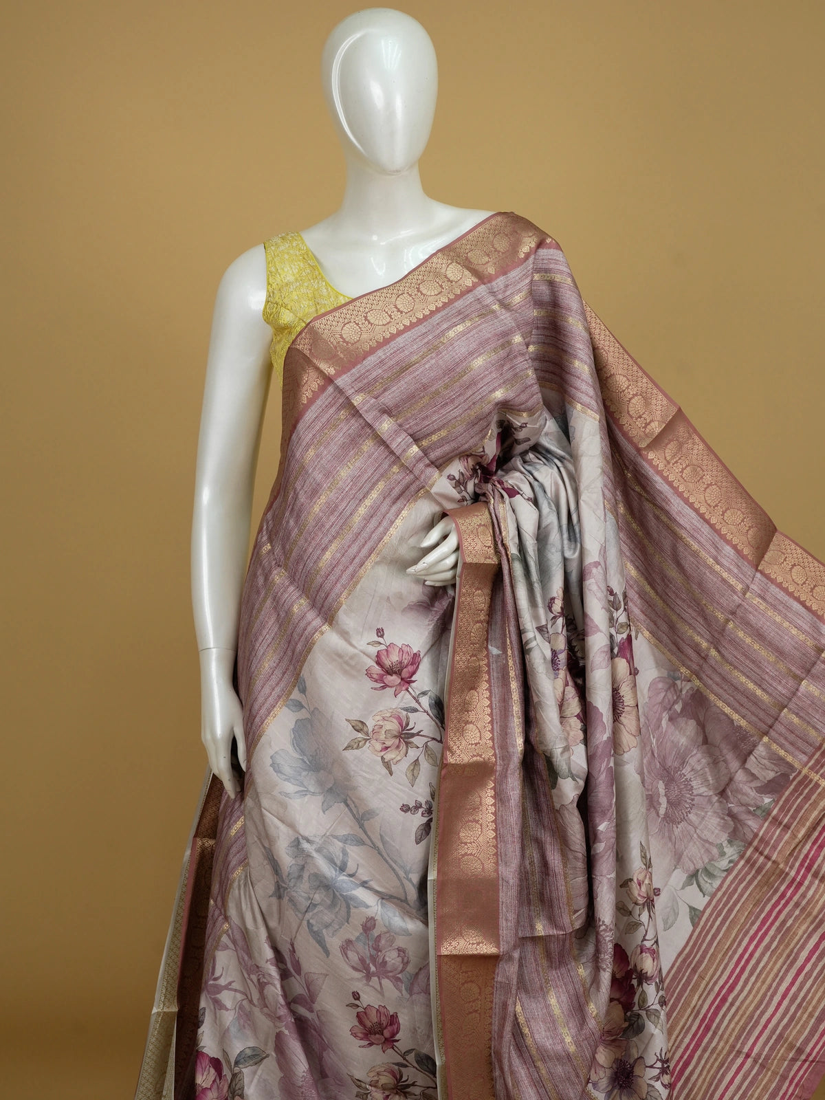 Cream and mauve floral semi tussar saree with gold zari contrast border and printed pallu