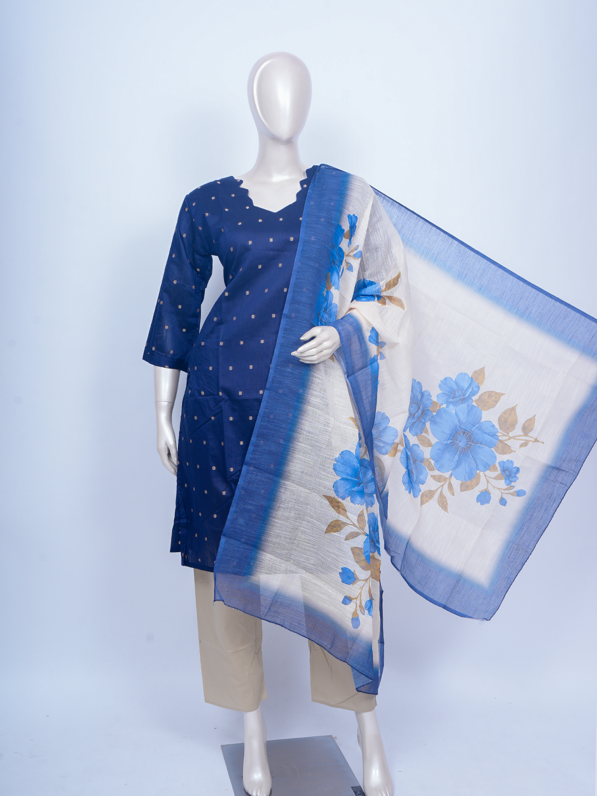 Navy blue zari butti kurti set with beige pants and cream blue floral print dupatta