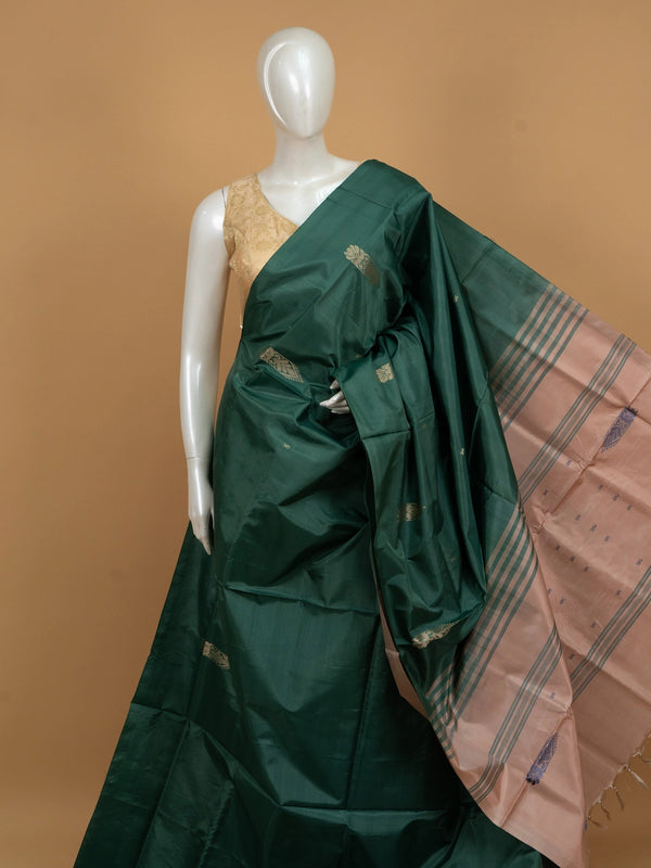 Bottle green banana silk saree with gold zari buttas and contrast peach striped pallu