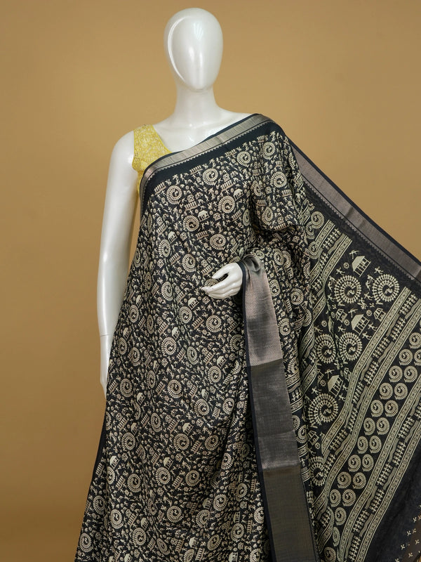 Black designer saree with cream Warli tribal art print and silver zari chevron border