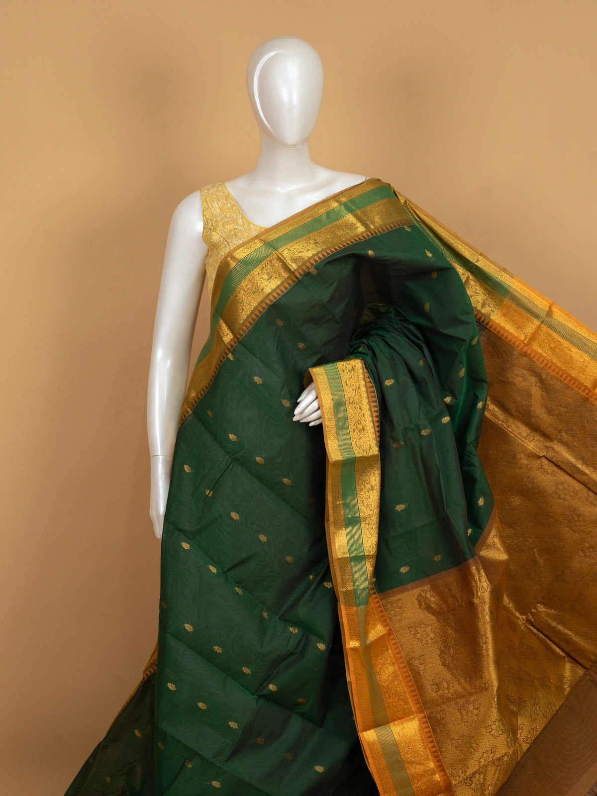 Dark green Chettinad cotton saree with gold zari temple border and woven zari pallu