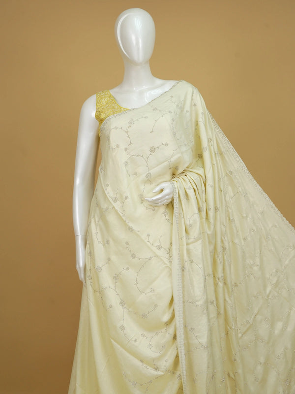Cream designer saree with silver sequin floral embroidery and scalloped border