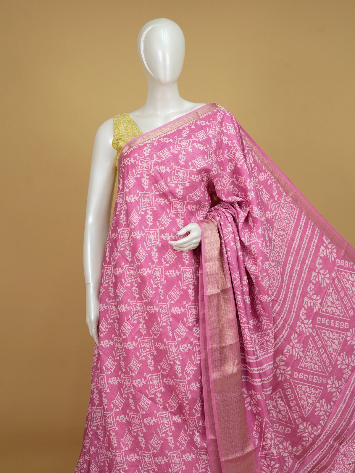 Pink and white batik print cotton designer saree with gold zari border
