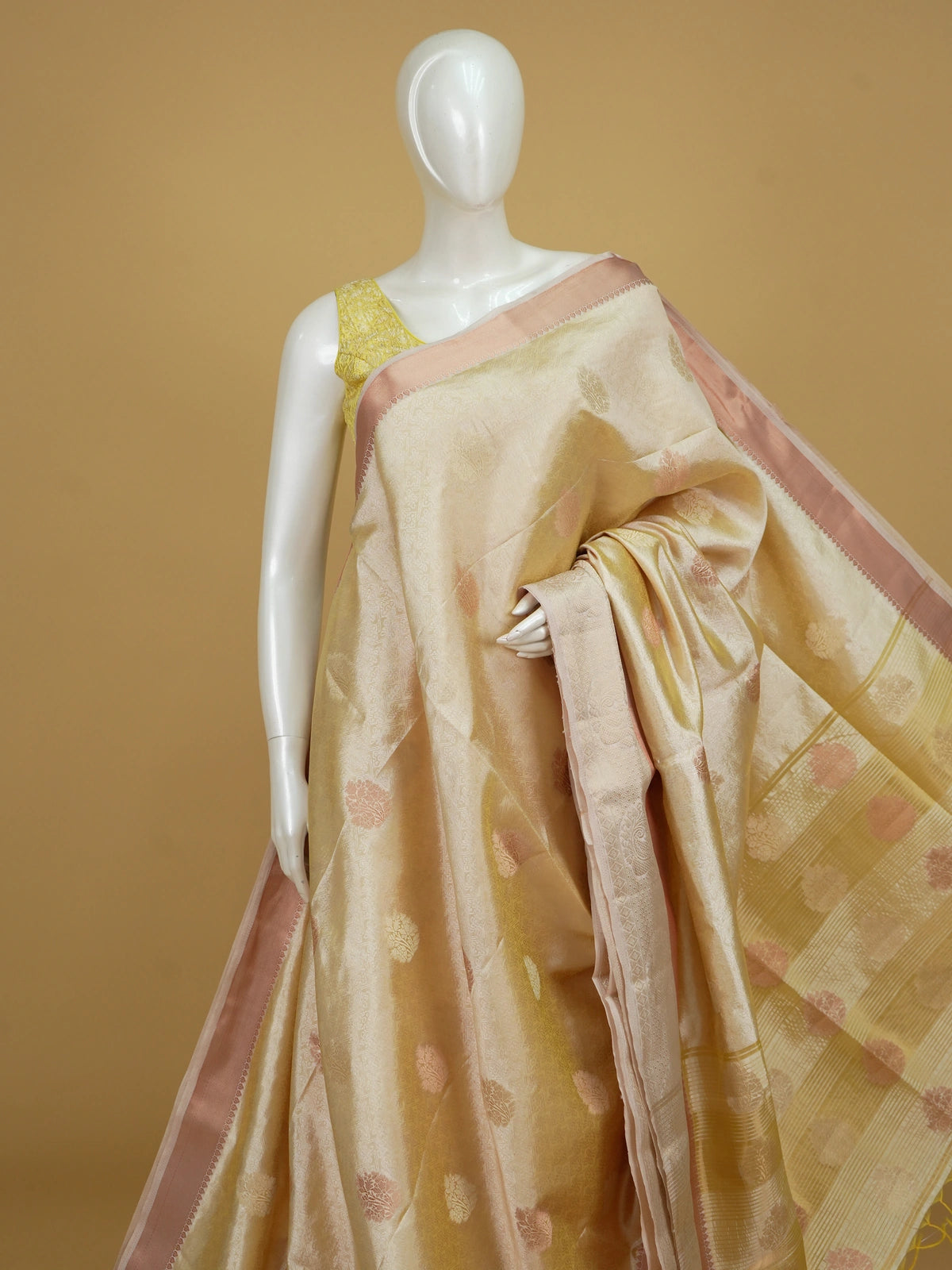 Cream gold semi tussar saree with woven floral zari buta and contrast peach border