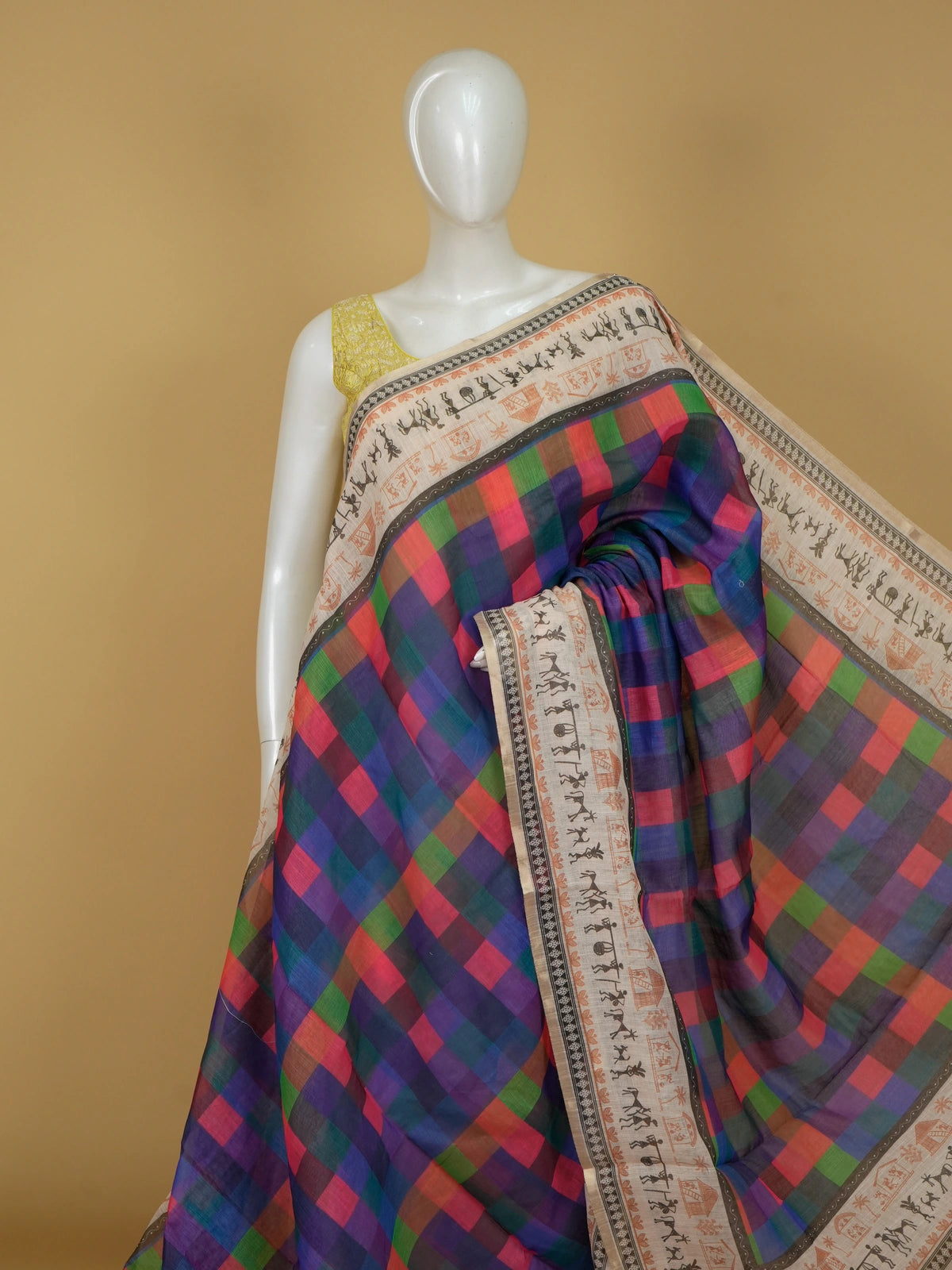 Multicolour checked linen cotton saree with cream Warli-art printed border and pallu