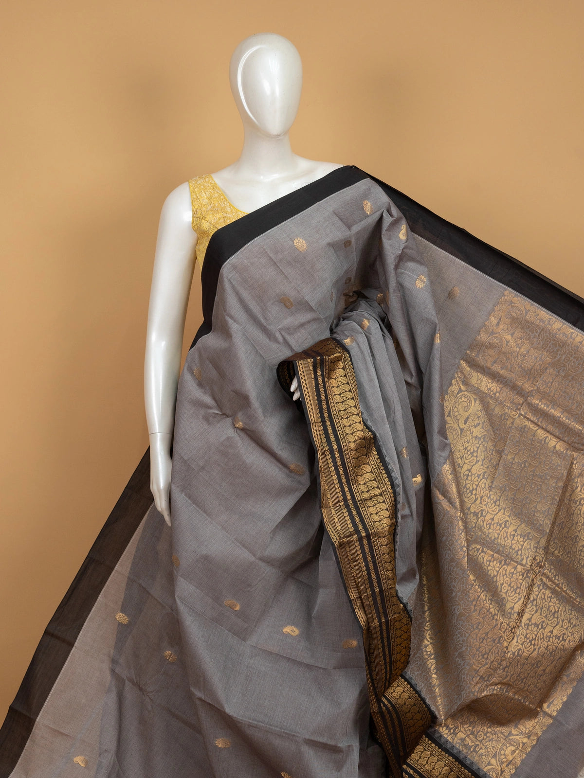 Grey Chettinad cotton saree with black contrast border and gold zari paisley buttas