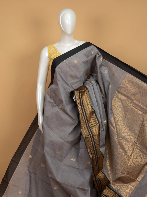 Grey Chettinad cotton saree with black contrast border and gold zari paisley buttas