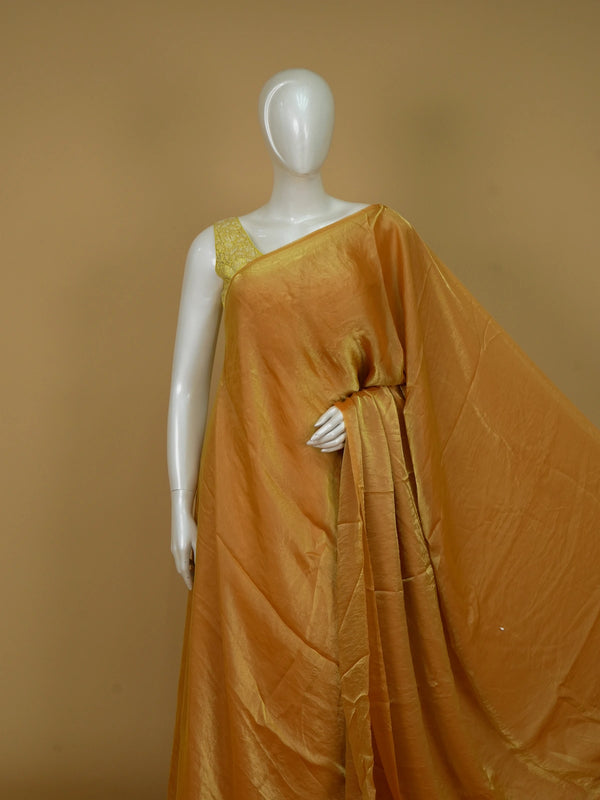 Mustard yellow tissue designer saree with shimmering body and contrast floral printed blouse