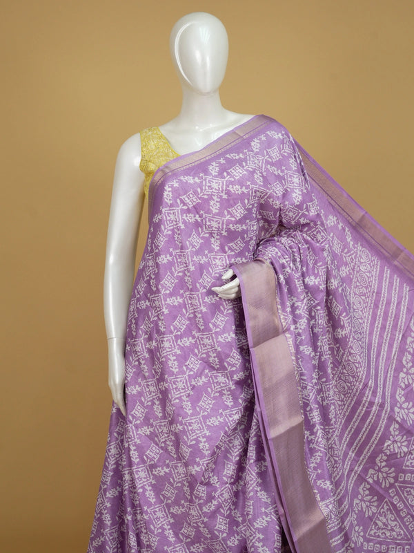 Lavender and white designer saree with batik-style print and zari border