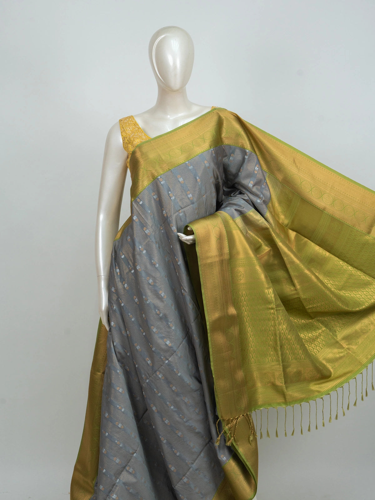 Grey Kanchipuram fancy silk saree with lime green and gold contrast zari border and buttas