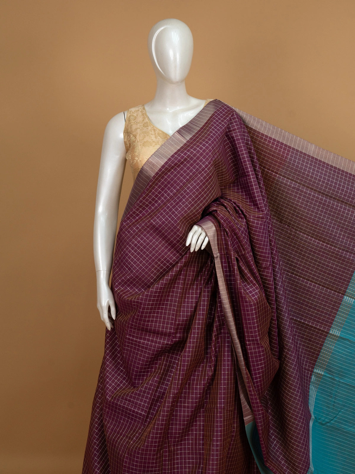 Wine purple checked linen cotton saree with contrast teal pallu and border