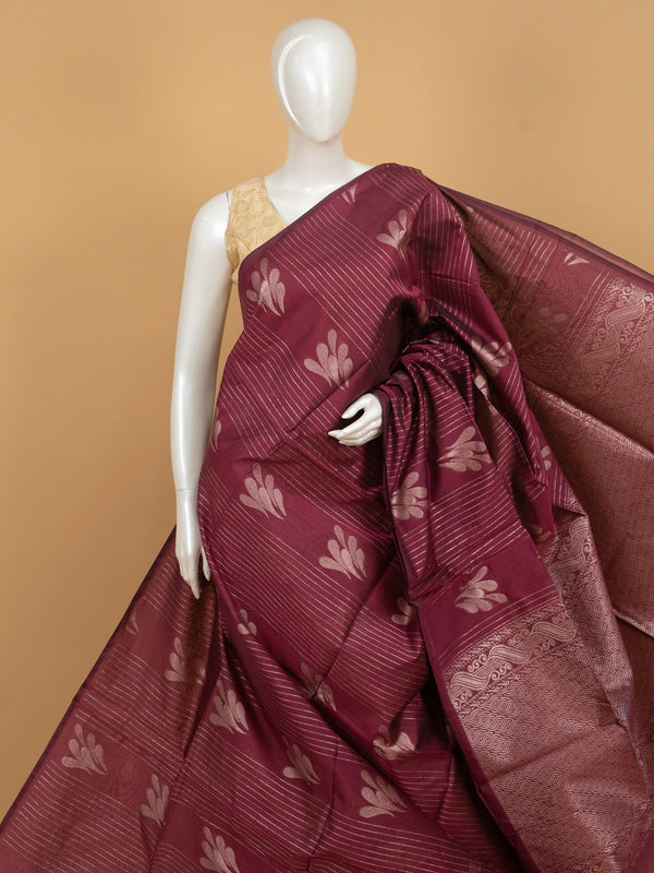 Maroon silk cotton saree with silver zari stripes, leaf motifs and woven scroll border