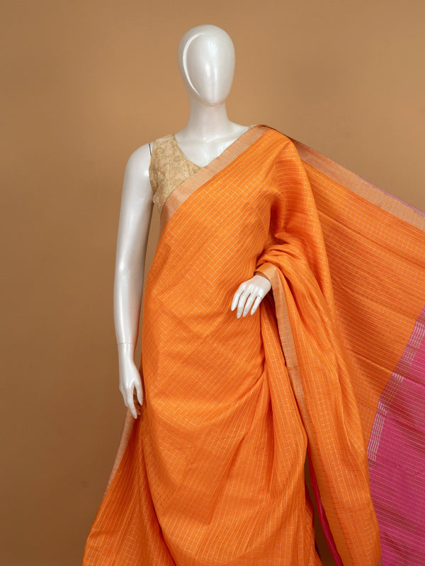 Orange linen cotton saree with white checks, contrast pink border with gold zari, and striped pink blouse