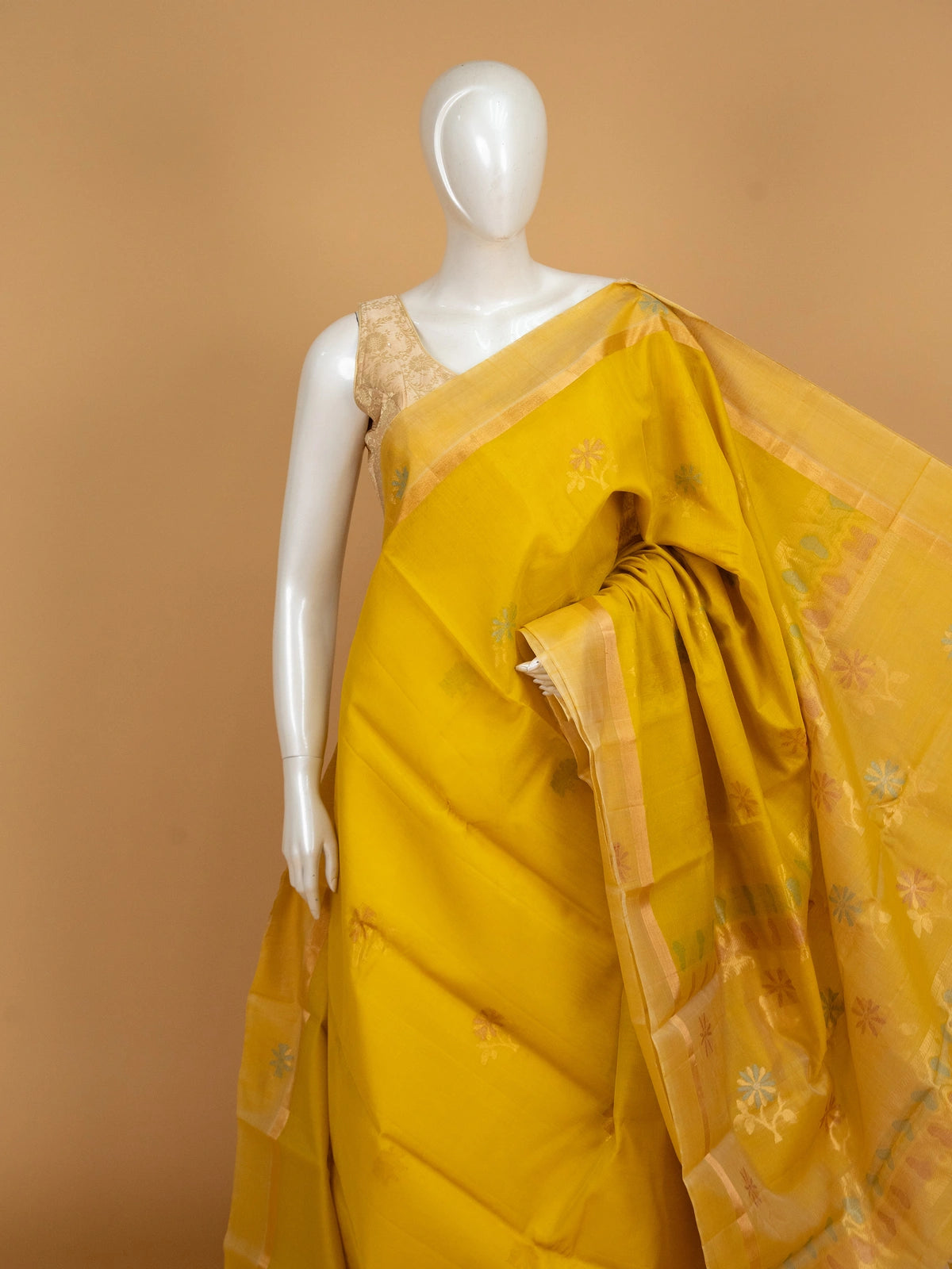 Bright yellow pure silk cotton saree with floral buta motifs and gold zari border