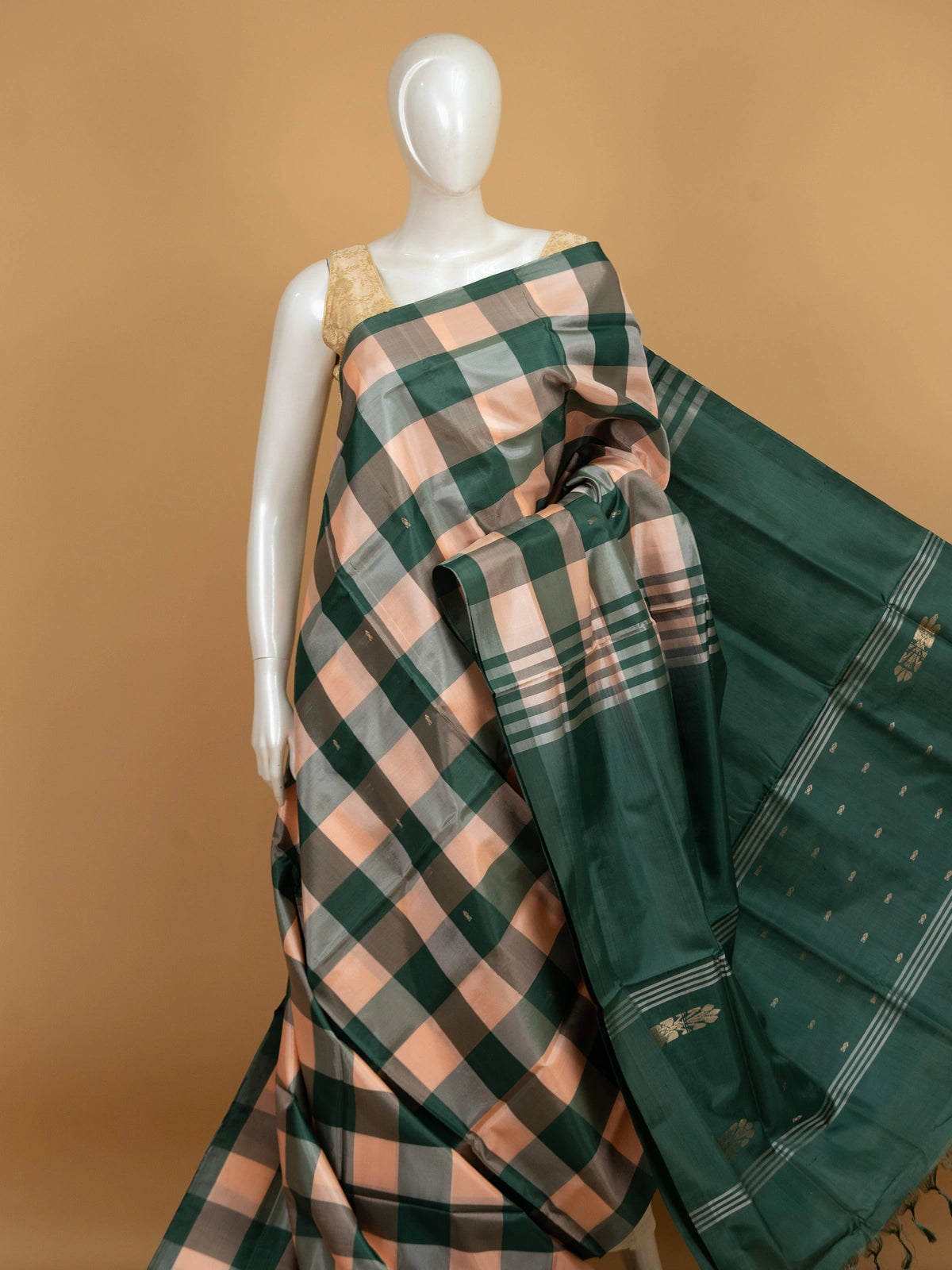 Green and peach checked banana silk saree with dark green zari pallu and border