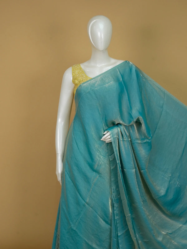 Turquoise blue shimmer tissue designer saree with printed floral-paisley contrast blouse