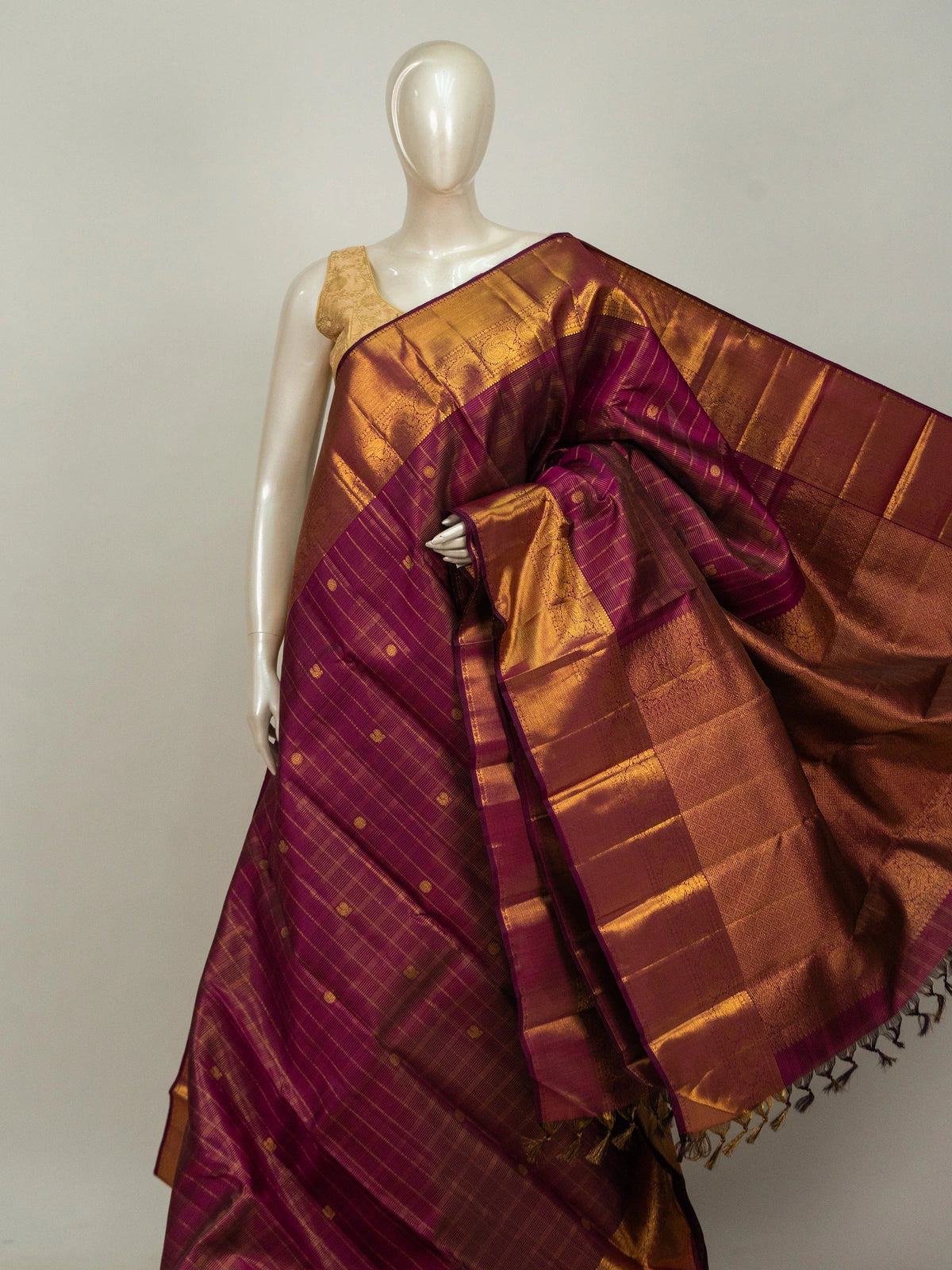 Magenta pure Kanchipuram silk saree with gold zari checks and contrast peacock-motif border