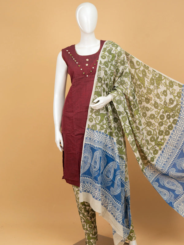 Maroon cotton straight cut kurti set with pom-pom neckline, green kalamkari printed pants and contrast kalamkari dupatta