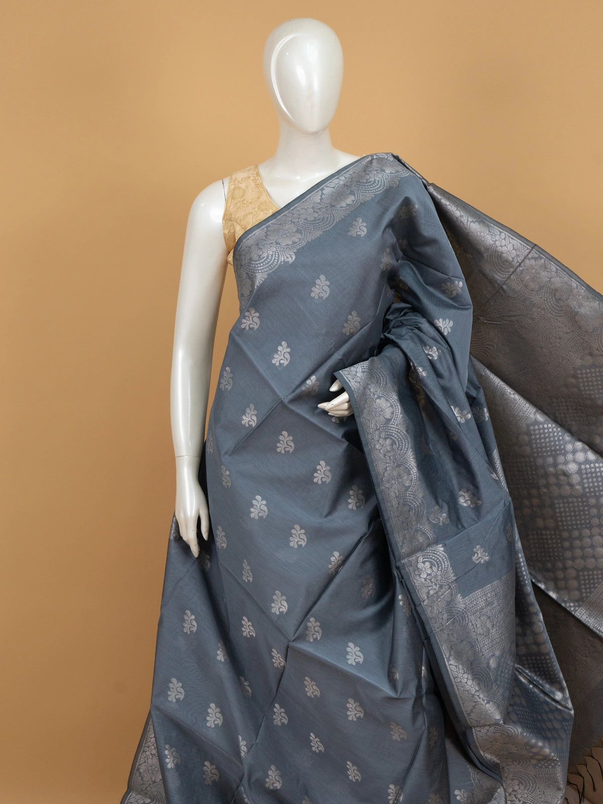 Grey silk cotton saree with silver zari floral buttas and ornate zari pallu