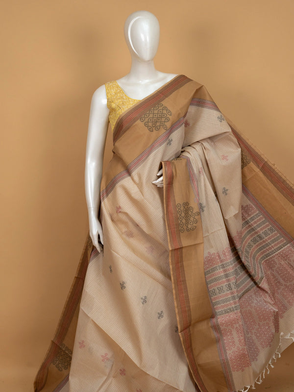 Beige and tan semi raw silk saree with contrast tan border and woven kolam motifs