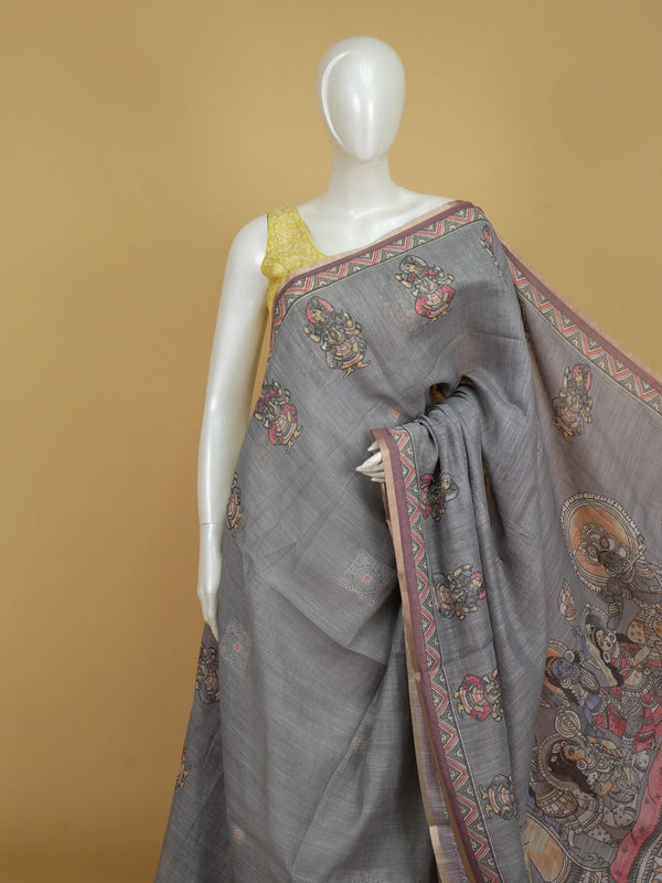 Grey linen cotton saree with Kalamkari-style figurative prints, coral chevron border and contrast mauve blouse