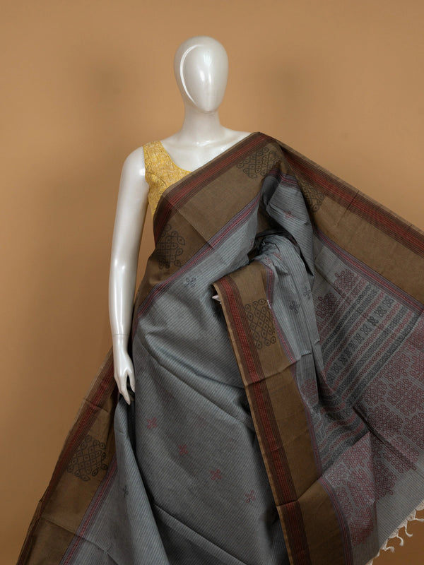 Grey and brown semi raw silk saree with contrast thread border and woven kolam motifs