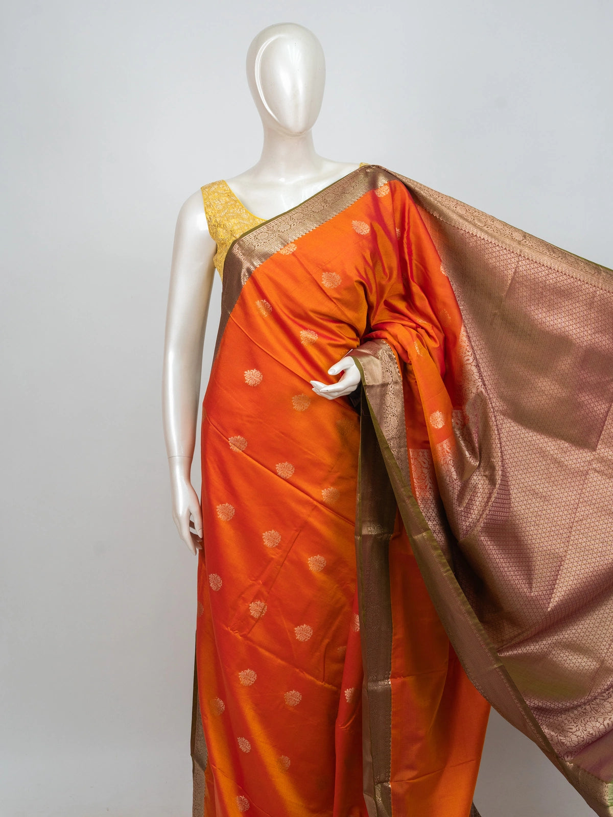 Orange semi silk saree with gold zari buta motifs and contrast copper-gold zari border and pallu