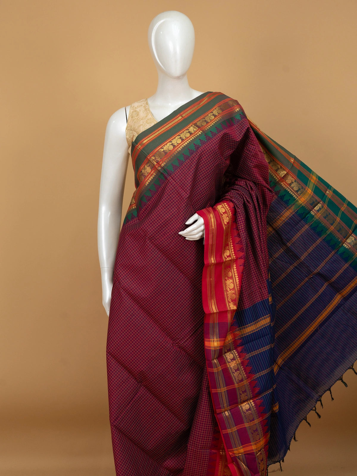 Maroon and blue Chettinad cotton saree with gold check body, contrast green zari border and striped blue pallu