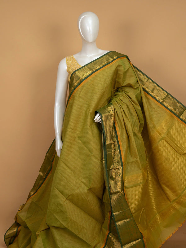 Mehendi green Chettinad cotton saree with checked body and gold zari floral border