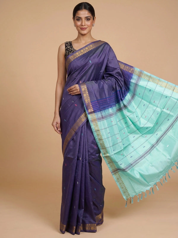 Deep purple Banana Silk saree with contrast turquoise pallu, gold zari border and buti motifs